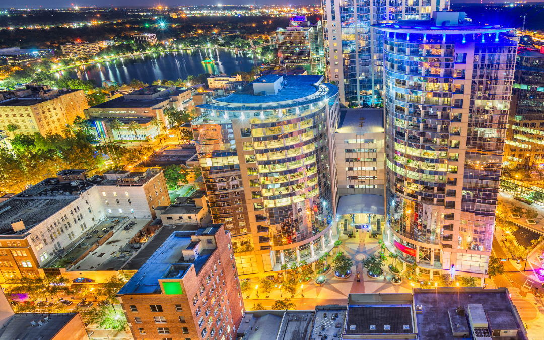 Picture of an overhead looking over the orlando city with buildings that have the lights on,