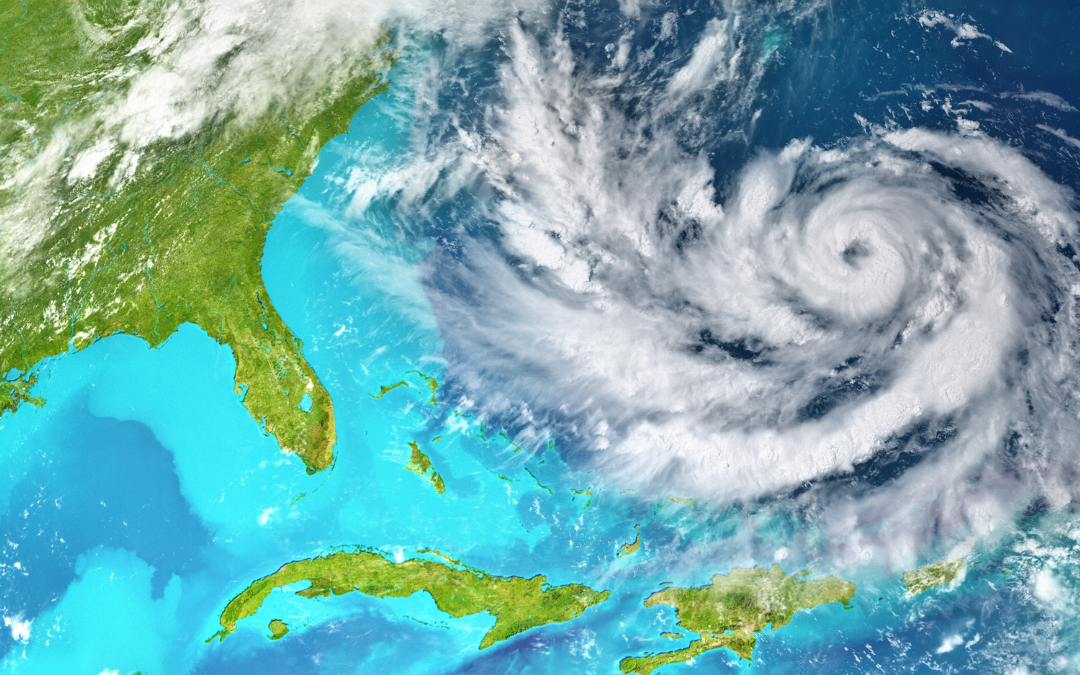 There is a picture of a satellite image of the florida that is green surrounded by ice blue waters. To the right there is a circular white cloud approaching the state.