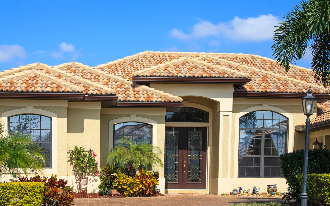 There is a picture of a house located in weston florida that depicts the community in the blog,. There is a bright blue sky and nice yellow house with tile roofing.