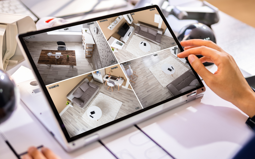 There is a picture of a tablet showing different rooms with cameras. There are two hands holding the tablet.