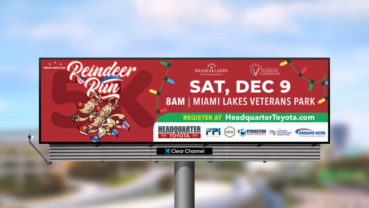 Picture of a red digital billboard that says reindeer run 5lk with 3 reindeer on the left side of the design. THere is also on the right hand side wording that says sat, dec 9 aam miami lakes veteran's park register at headquartertoyota.com. There is also a list of sponsors on the sign as well.